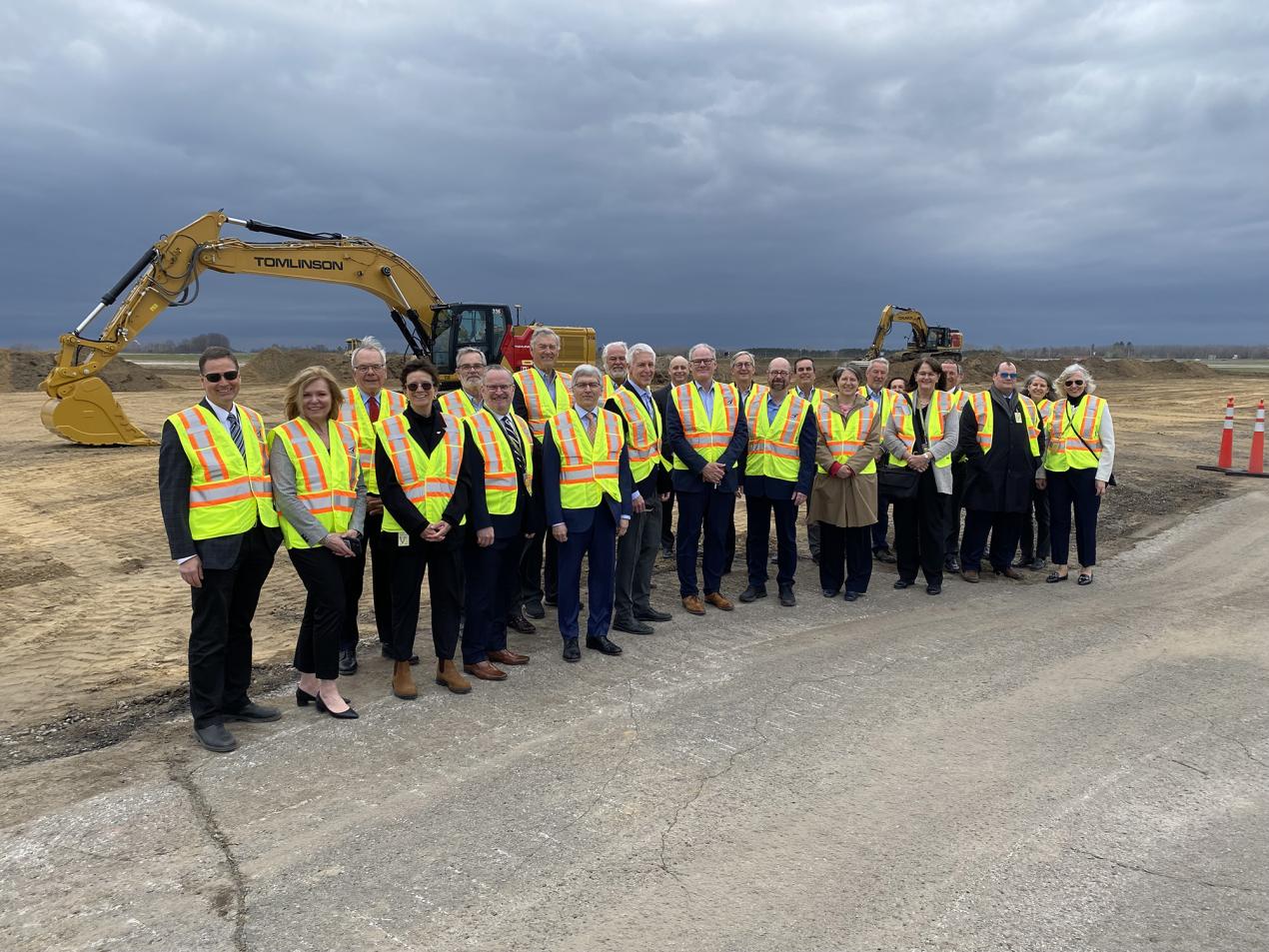 Groundbreaking event for Romeo Taxiway. From left to right : Marcel Mathurin, Krista Kealey, Chris Carruthers, Bonnie Boretsky, Kevin McGarr, Colin Morrison, Dick Brown, Marc Joyal, Bruce Lazenby, Michael Tremblay, Joel Tkach, Mark Laroche, Ian Sherman, Code Cubitt, Rob Turpin, Michèle Lafontaine, John Proctor, Lisa Dwyer, Deanna Monaghan, Marc Gervais, Shane Bennett, Chantal Bourdeau, Carole Presseault.